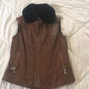 Black Rivet vest size small.